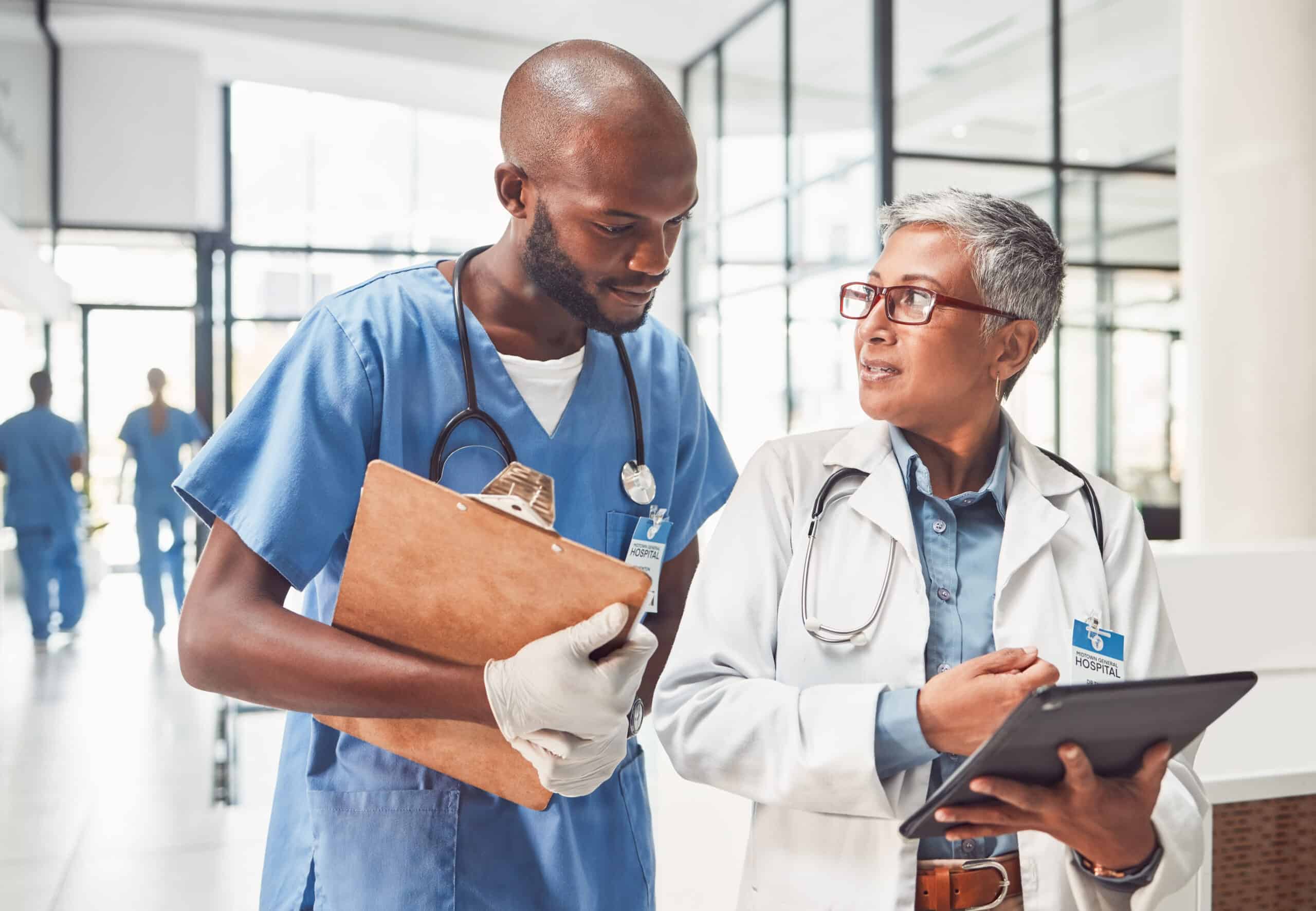 Doctors, nurse and teamwork on tablet for hospital management, data report and black people support. Clinic results, research and data analysis of professional healthcare worker and medical manager