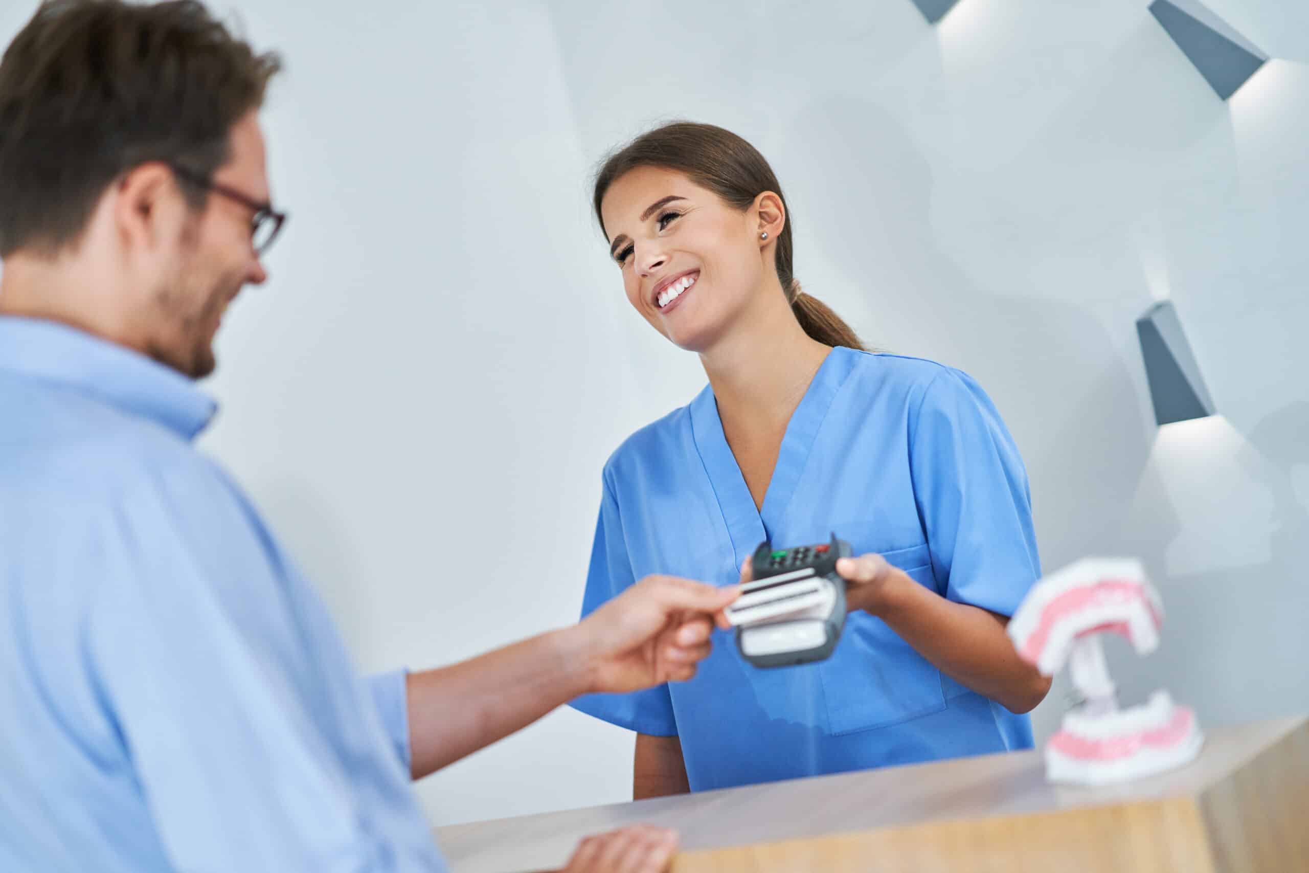 Patient paying for visit in clinic